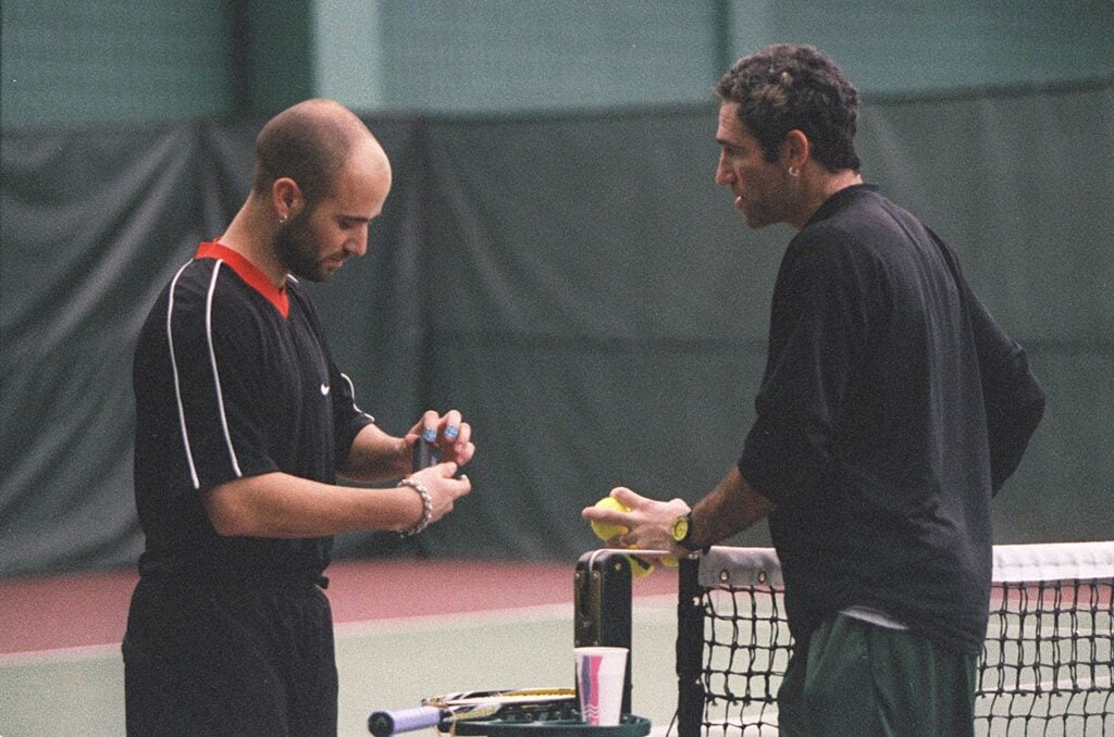 AGASSI 1/C/23JAN97/SP/LS Andre Agassi chats with his coach, Brad Gilbert, at the San Francisco Tennis Club. Photo By Lea Suzuki