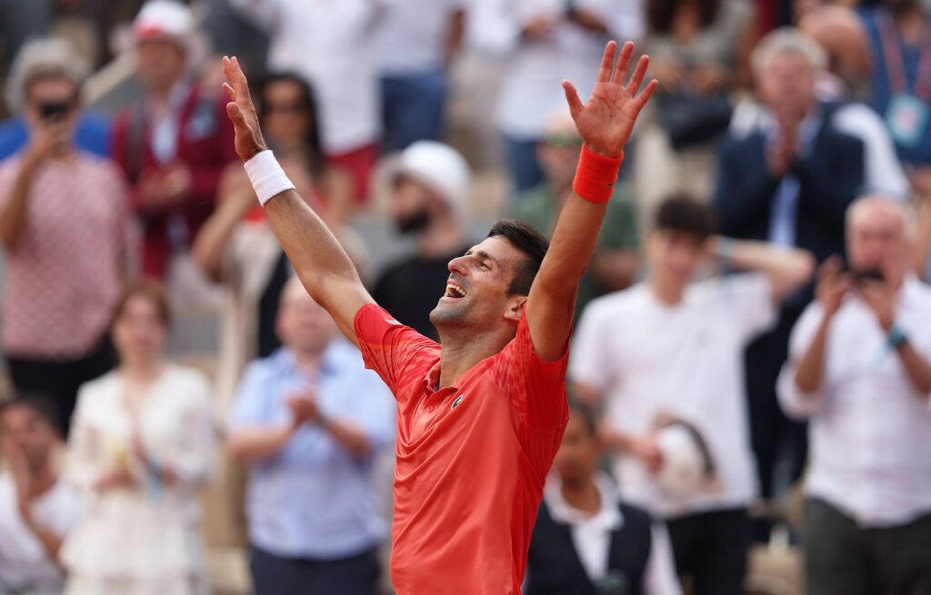 Novak Djokovic celebrates after winning the 2023 French Open.