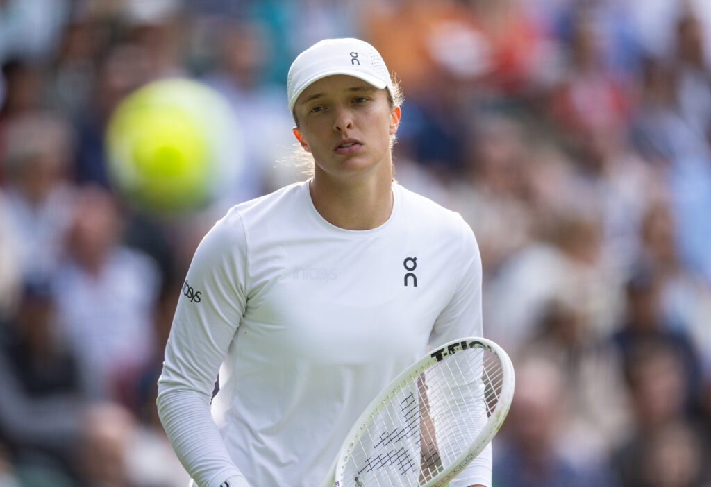 Iga Swiatek reacts during her match with Petra Martic at Wimbledon in 2024