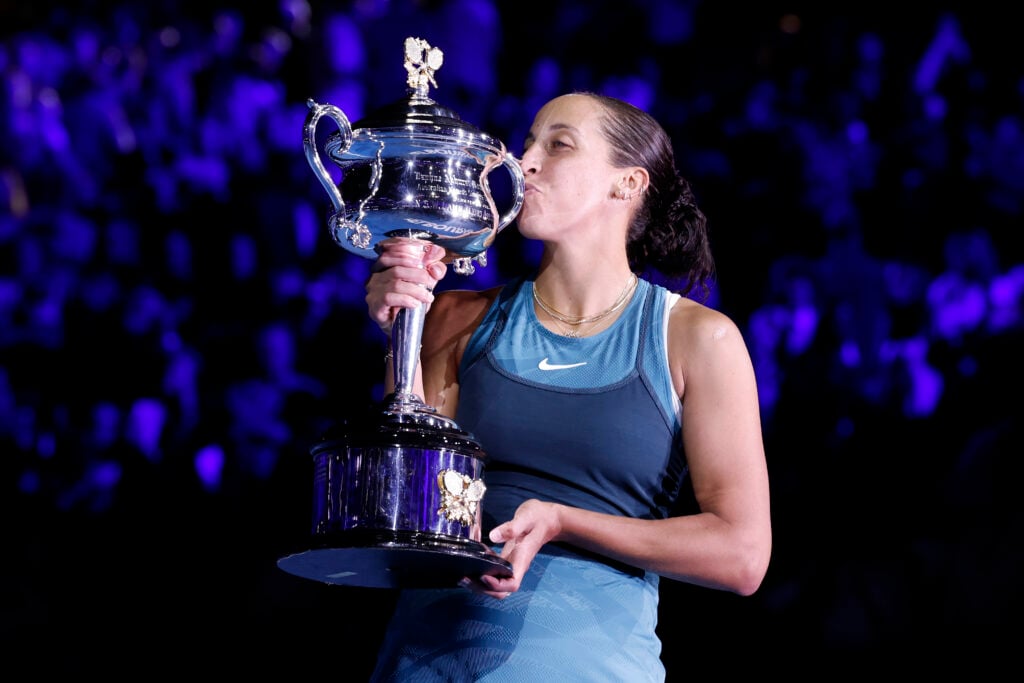 Madison Keys of the United States kisses the Daphne Akhurst Memorial Cup after the Women's Singles Trophy Presentation following the Women's Singles Final against Aryna Sabalenka during day 14 of the 2025 Australian Open at Melbourne Park