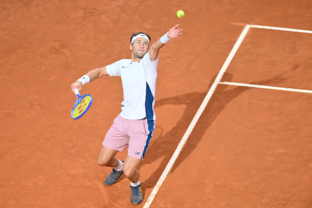 Casper Ruud serving against Jannik Sinner at the 2025 Italian Open