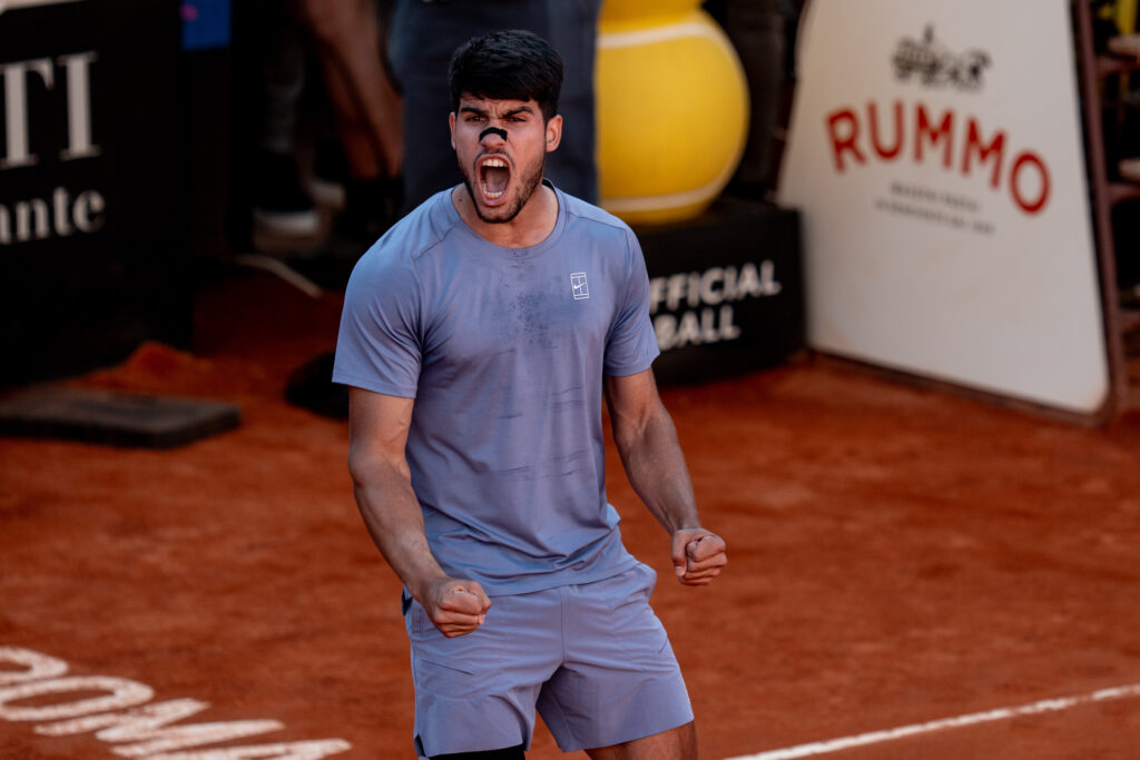 Carlos Alcaraz celebrates after beating Lorenzo Musetti at the Italian Open