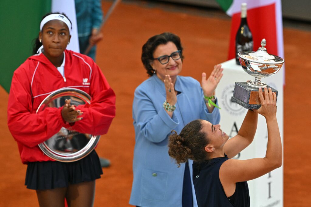Coco Gauff and Jasmine Paolini hold their trophies after the 2025 Italian Open final