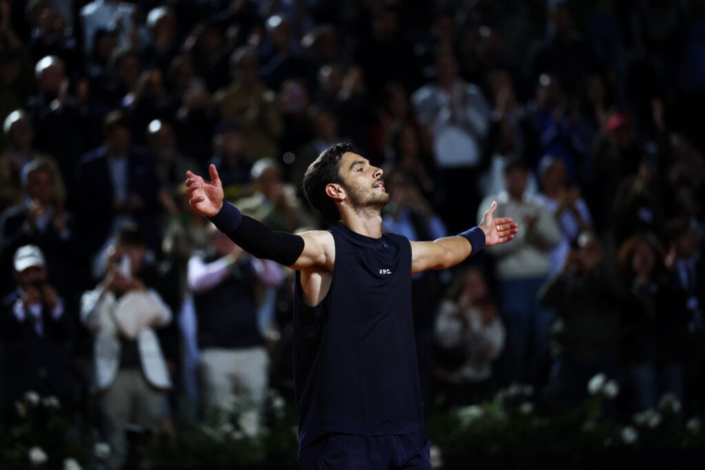 Lorenzo Musetti takes in the applause from the Italian Open crowd after beating Alexander Zverev