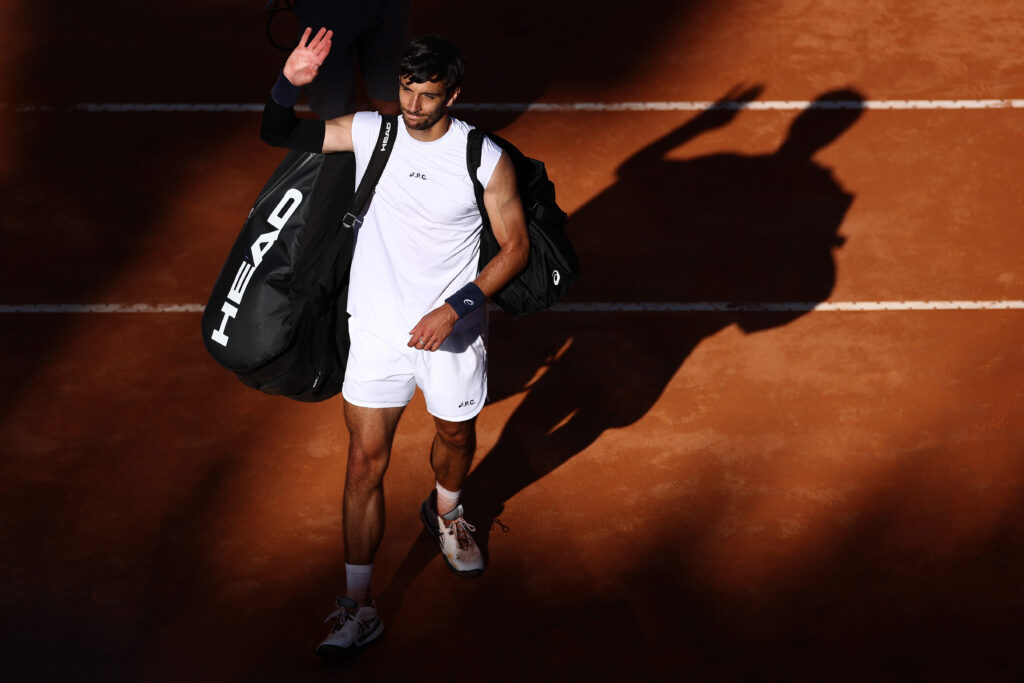 Lorenzo Musetti waves goodbye to the crowd after losing to Carlos Alcaraz in Rome