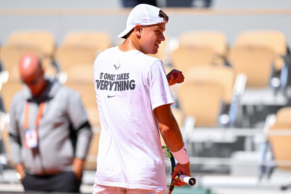 Holger Rune looks on during training ahead of the 2025 French Open