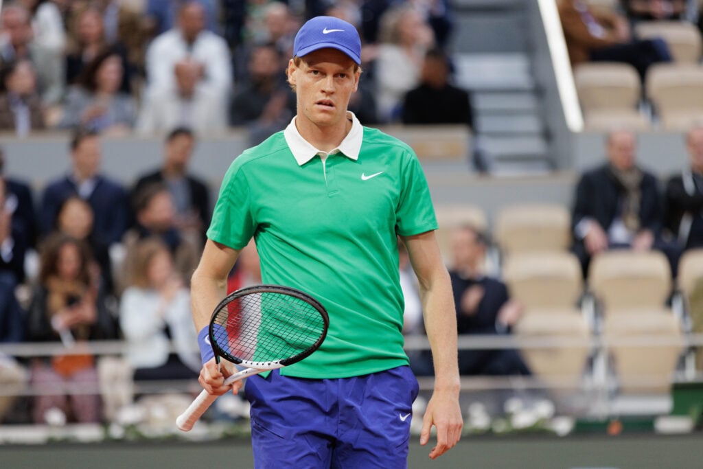 of Italy looks on against Arthur Rinderknech of France during the Men's Singles First Round match on Day Two of the 2025 French Open at Roland Garros.
