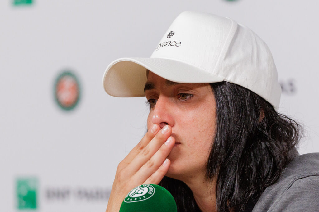 Ons Jabeur speaks during a press conference following her first-round defeat at the 2025 French Open