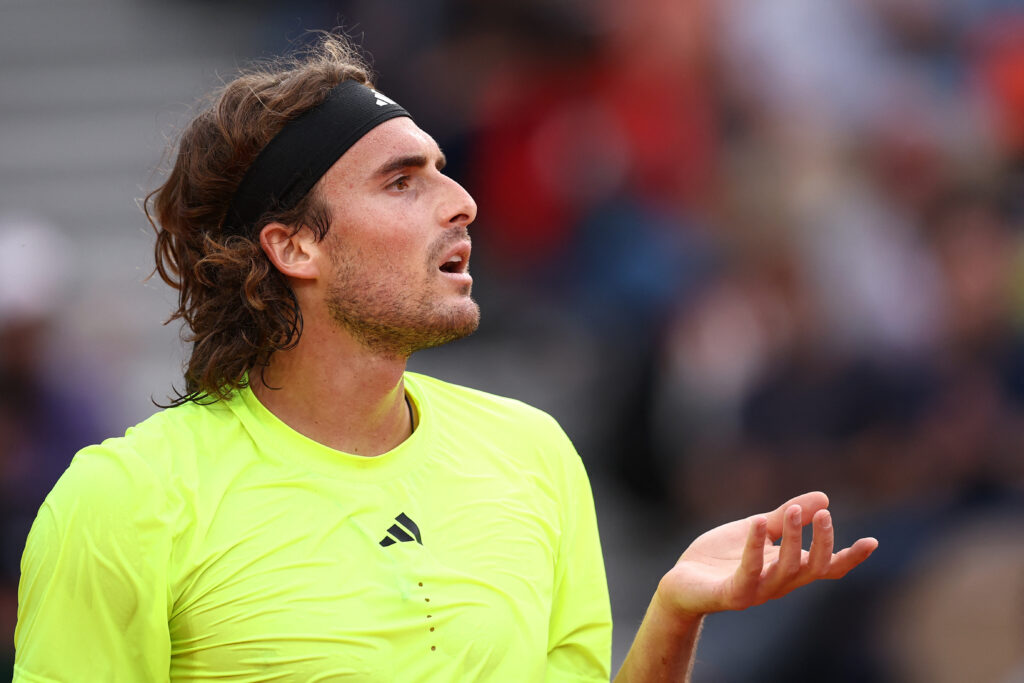 Stefanos Tsitsipas reacts during defeat to Matteo Gigante at the 2025 French Open