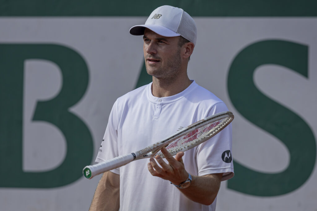 Tommy Paul spinning his racket at the French Open
