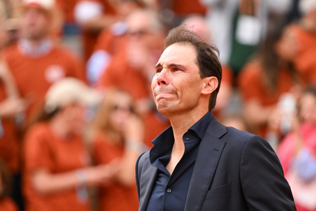 Rafael Nadal of Spain gets a standing ovation as he does a lap of honour around the court during the presentation ceremony paying tribute to his career, on a packed Court Philippe-Chatrier during Day One of the 2025 French Open at Roland Garros.
