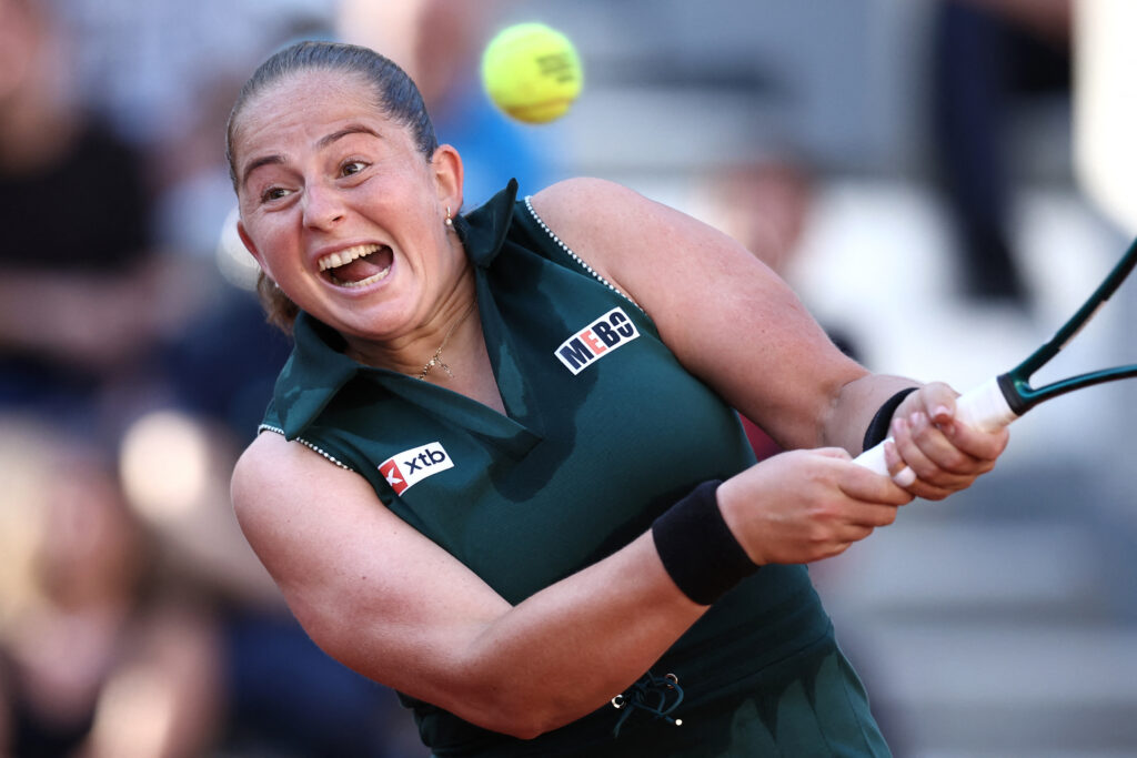 Jelena Ostapenko returns a ball to Elena Rybakina during their match at the 2025 French Open