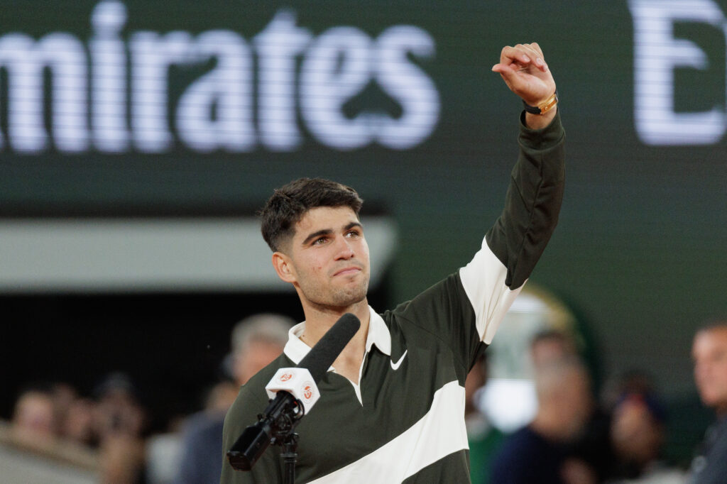 Carlos Alcaraz acknowledges the French Open crowd after his third-round victory.