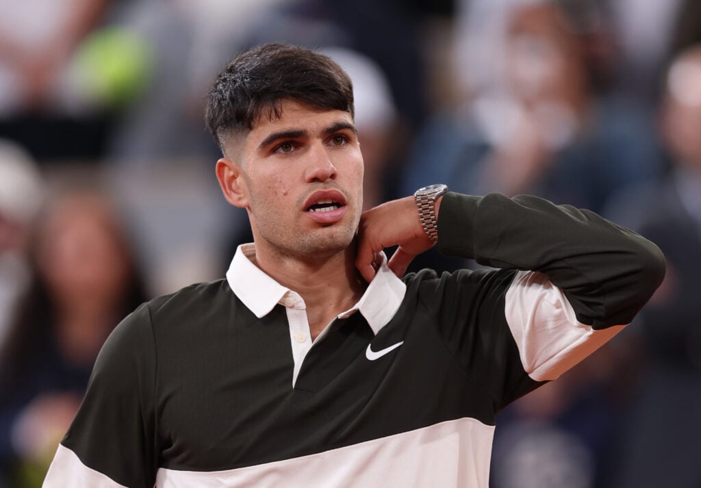 Carlos Alcaraz looks on after his 2025 French Open win over Fabian Marozsan