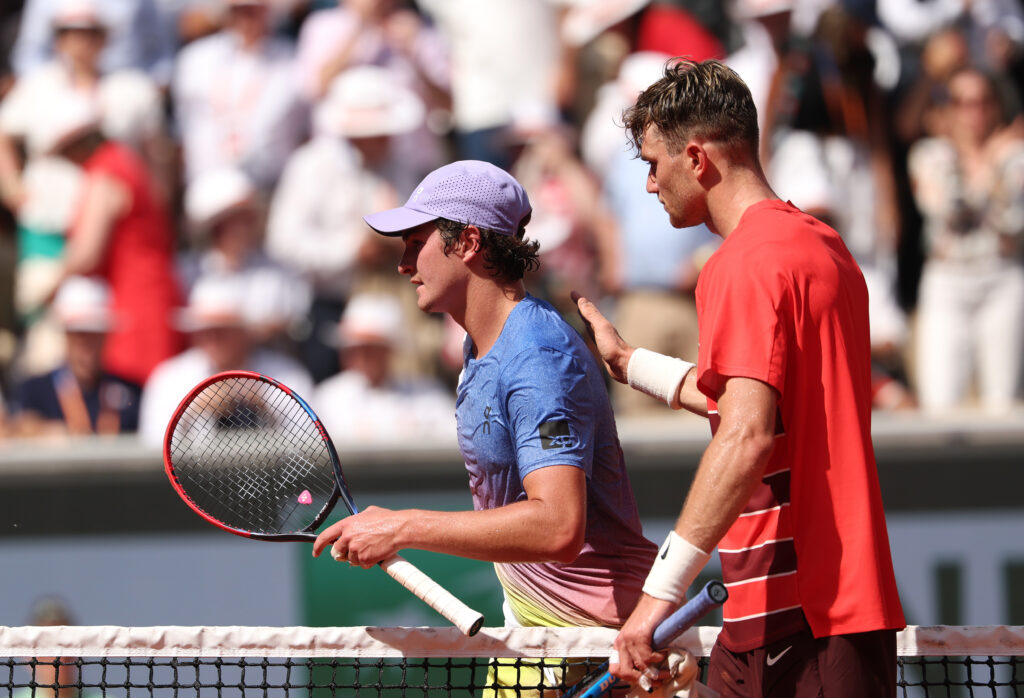 Jack Draper and Joao Fonseca embrace at the net after their 2025 French Open match