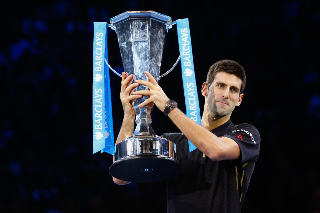 Novak Djokovic celebrates with the 2014 ATP Finals title