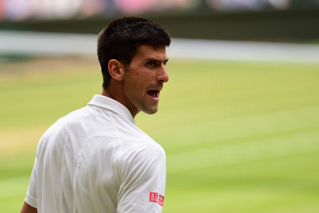 Novak Djokovic looking frustrated during his 2015 Wimbledon final against Roger Federer