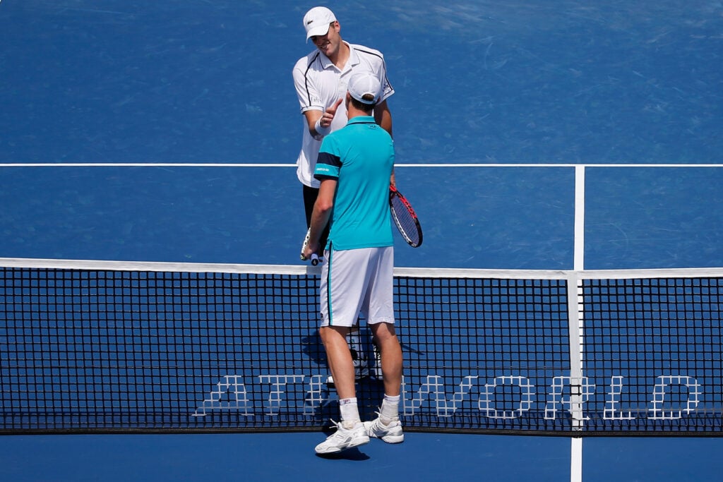 Sam Querrey and John Isner shake hands at the net after their 2015 Cincinnati Open match