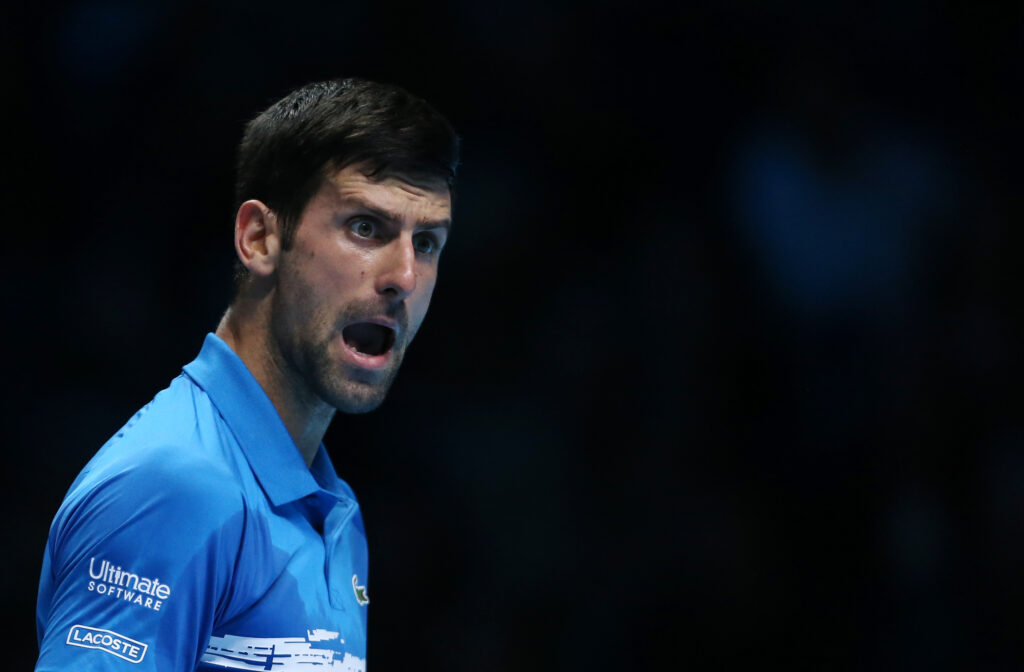 Novak Djokovic reacts during his group stage match at the 2019 ATP Finals