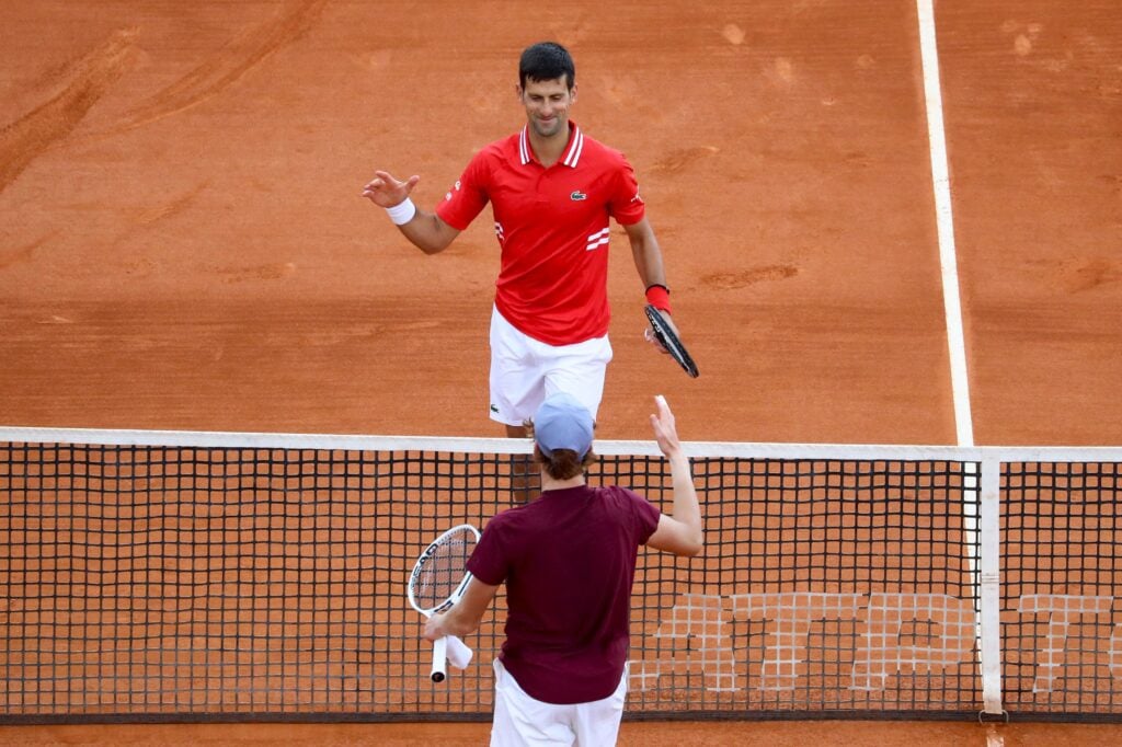 Serbia's Novak Djokovic shakes hands with Italy's Jannik Sinner after winning in their second round singles match on day five of the Monte-Carlo ATP Masters Series tournament in Monaco.