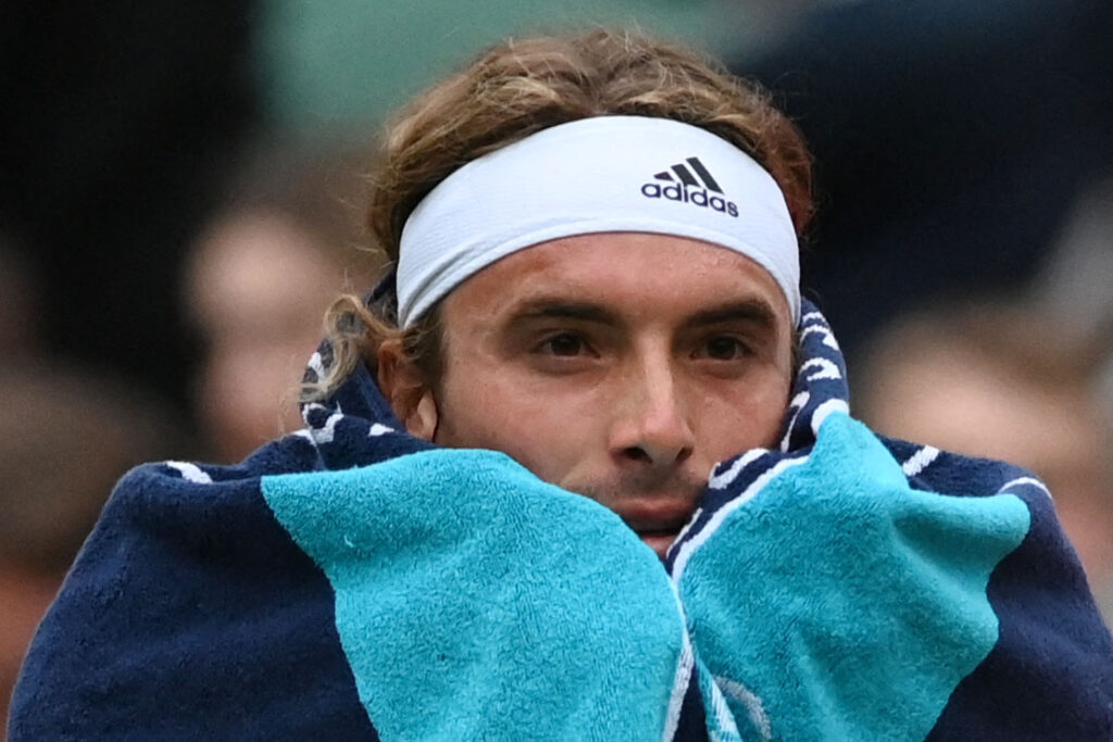 Stefanos Tsitsipas reacts during his match with Nick Kyrgios at Wimbledon in 2022.