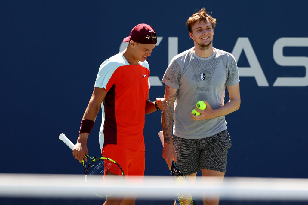 Alexander Bublik of Kazakhstan and Holger Rune of Denmark react to a point against Quentin Halys and Adrian Mannarino of France during their Men's Doubles Second Round match on Day Five of the 2022 US Open at USTA Billie Jean King National Tennis Center.