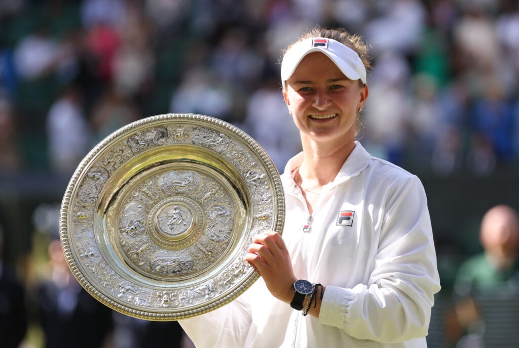 Barbora Krejcikova poses with the trophy after beating Jasmine Paolini in the 2024 Wimbledon final.
