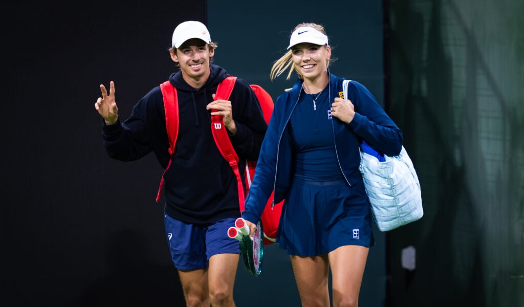 Alex de Minaur of Australia and Katie Boulter of Great Britain walk onto the court for the Eisenhower Cup at Indian Wells in 2025