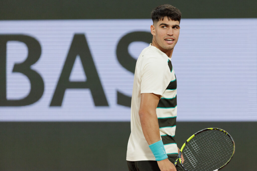 Carlos Alcaraz of Spain looks on against Fabian Marozsan of Hungary during the Men's Singles Second Round match on Day Four of the 2025 French Open at Roland Garros.