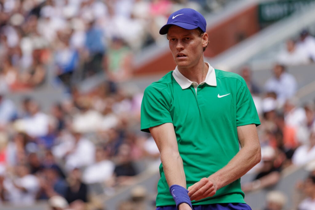 Jannik Sinner of Italy looks on against Richard Gasquet of France during the Men's Singles Second Round match on Day Five of the 2025 French Open at Roland Garros.