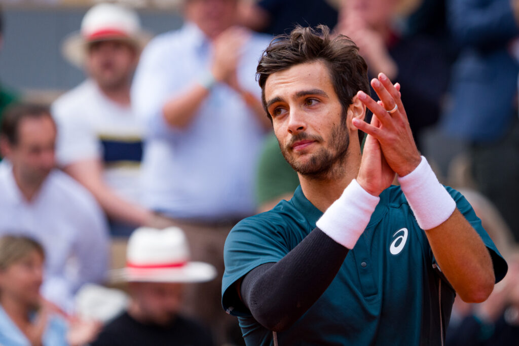 Lorenzo Musetti of Italy celebrates after his victory over Yannick Hanfmann of Germany in the Men's Singles First Round match on Day One of the 2025 French Open at Roland Garros.
