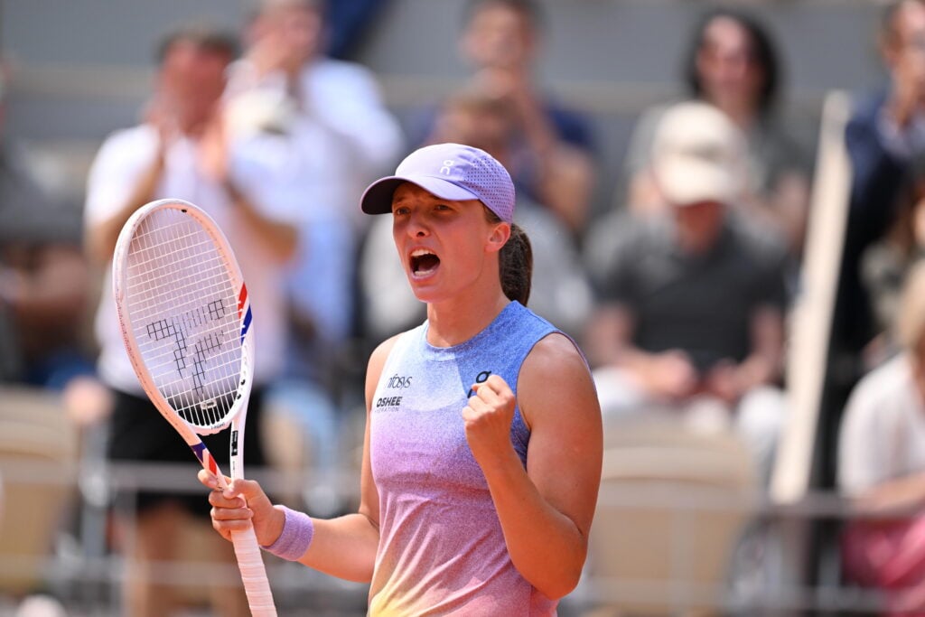 Iga Swiatek celebrates her win over Elina Svitolina at the 2025 French Open
