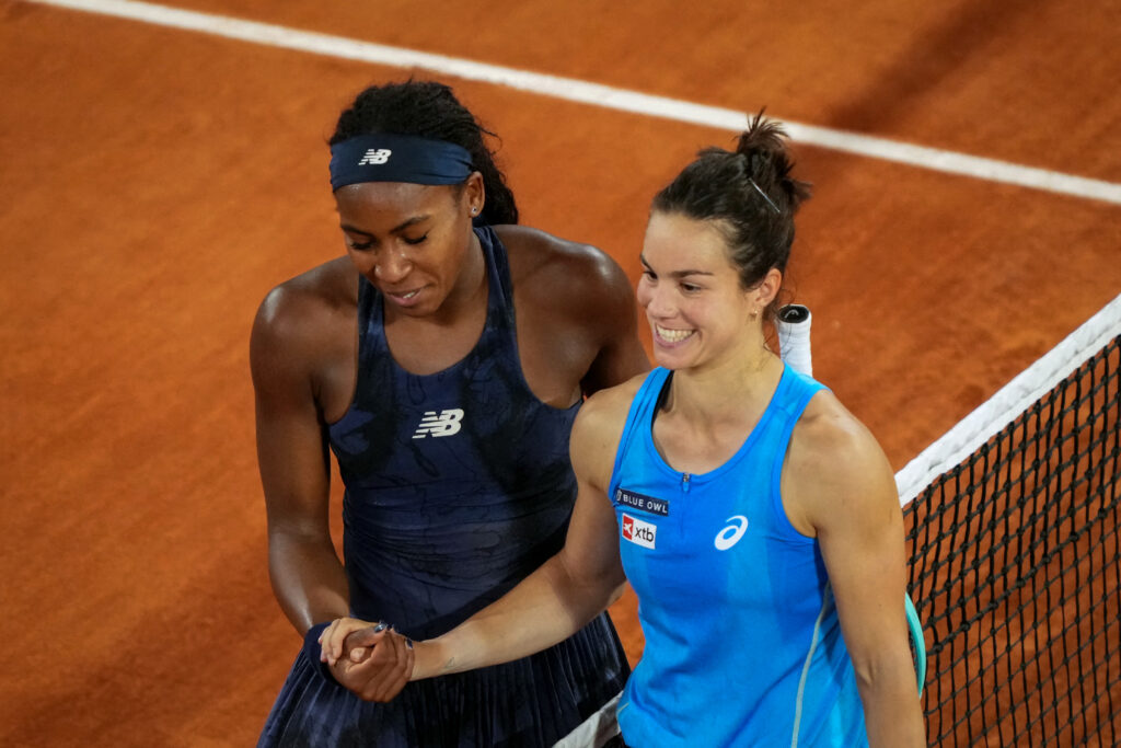 Coco Gauff shakes hands with Lois Boisson after winning their 2025 French Open semi-final