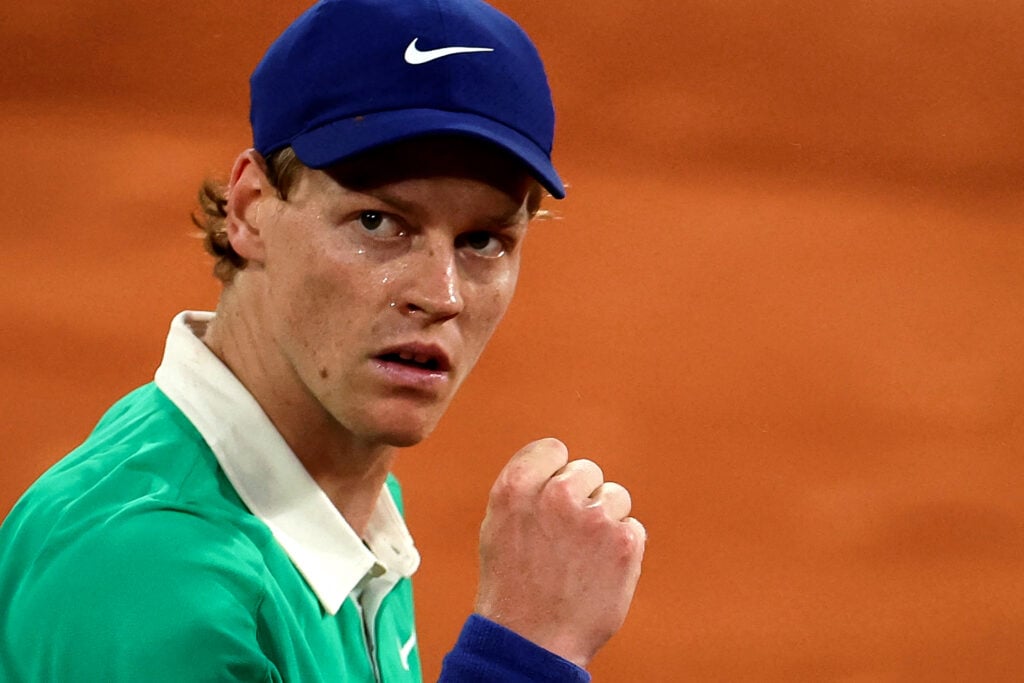 Jannik Sinner celebrates a point against Novak Djokovic at the 2025 French Open