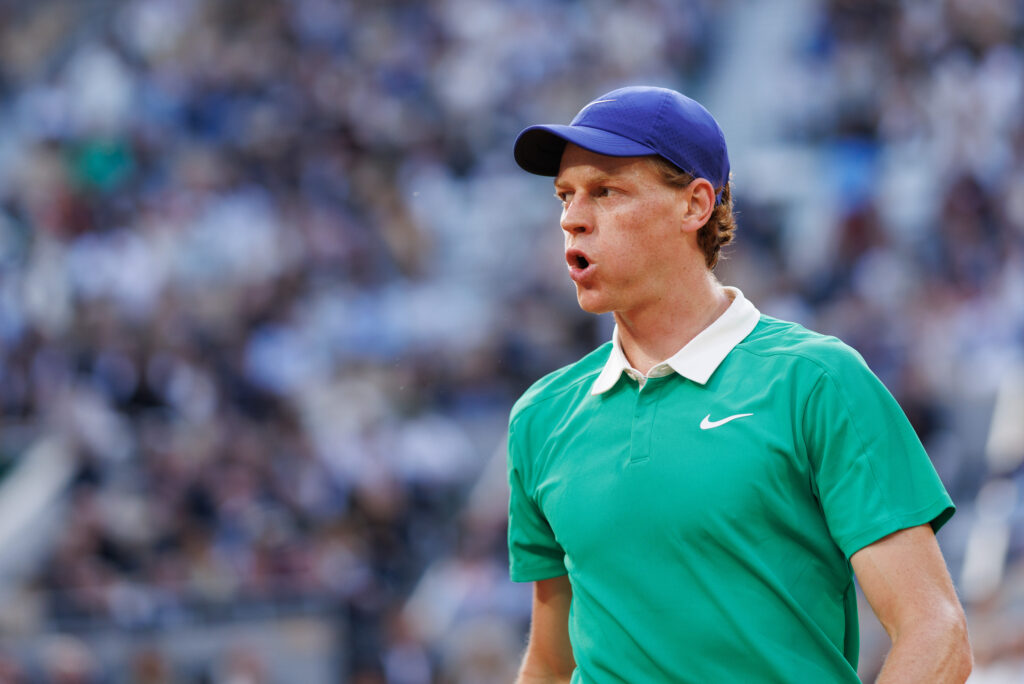 Jannik Sinner of Italy looks on against Novak Djokovic of Serbia during the Men's Singles Semi Final match on Day Thirteen of the 2025 French Open at Roland Garros.