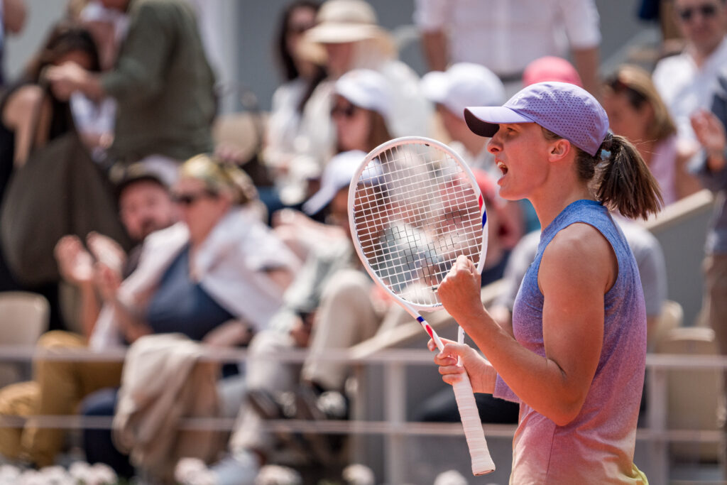 Iga Swiatek celebrates her win over Elina Svitolina at the 2025 French Open
