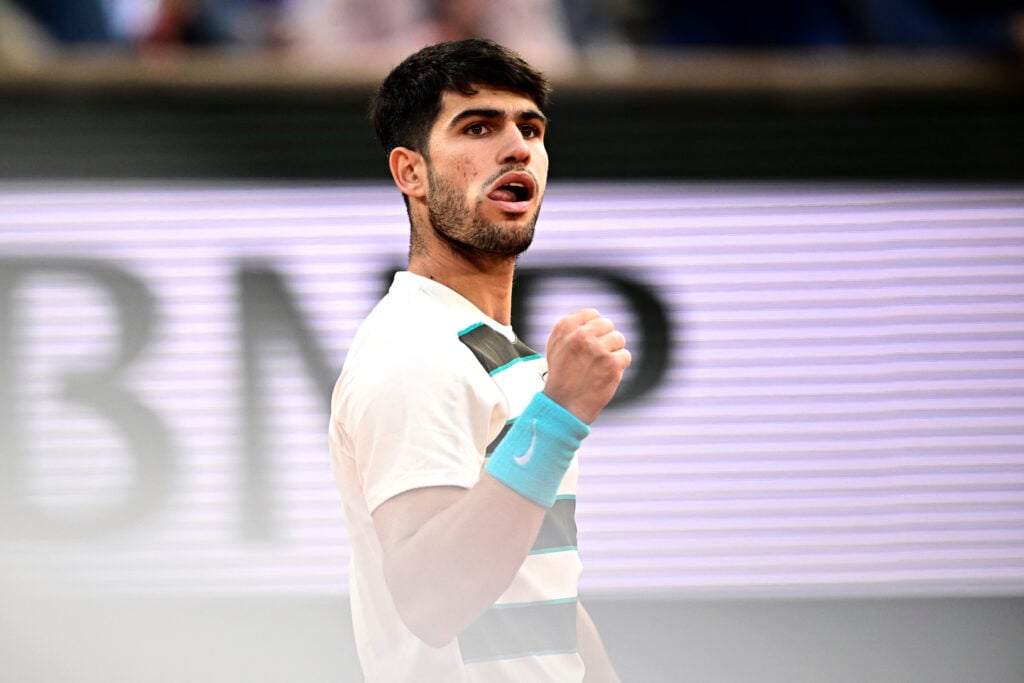 Carlos Alcaraz celebrates winning a point against Jannik Sinner in the 2025 French Open final