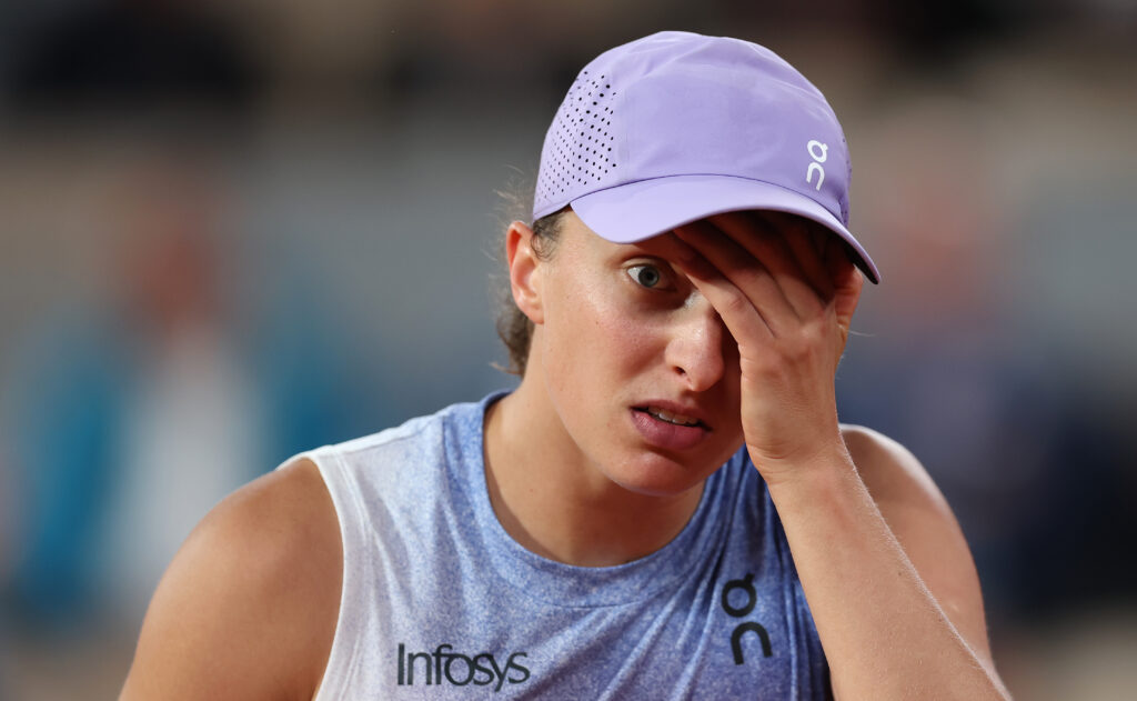 Iga Swiatek reacts during her defeat to Aryna Sabalenka at the 2025 French Open