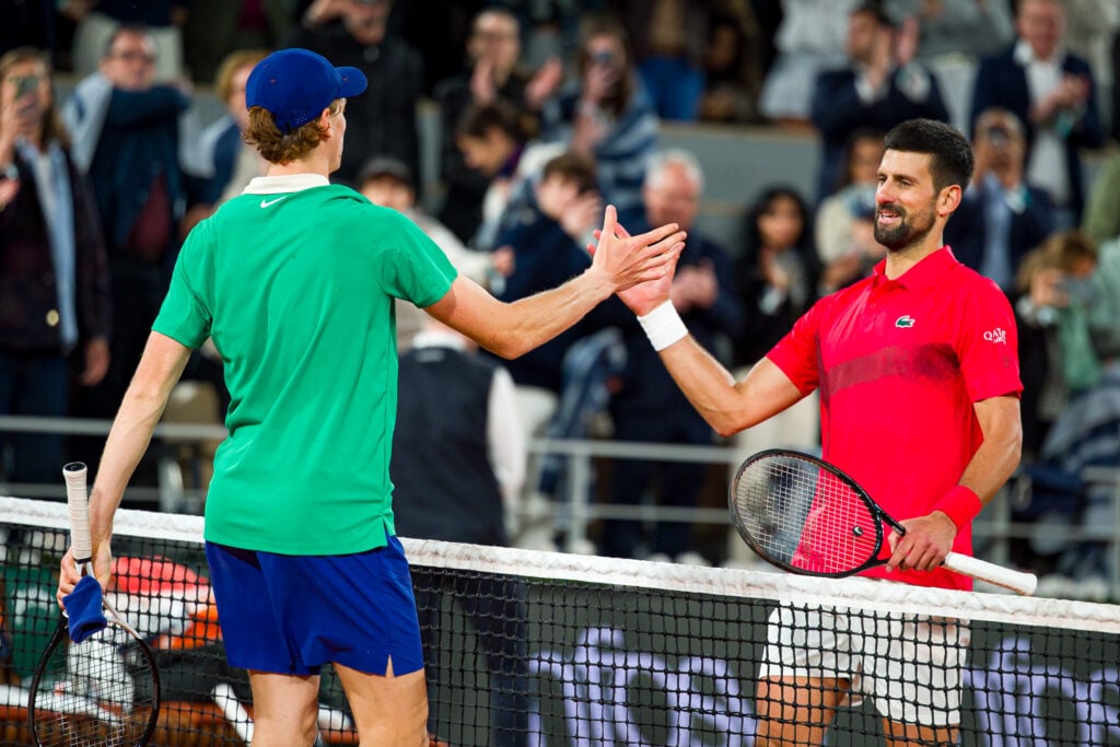 Jannik Sinner and Novak Djokovic shake hands at the net after their 2025 French Open semi-final