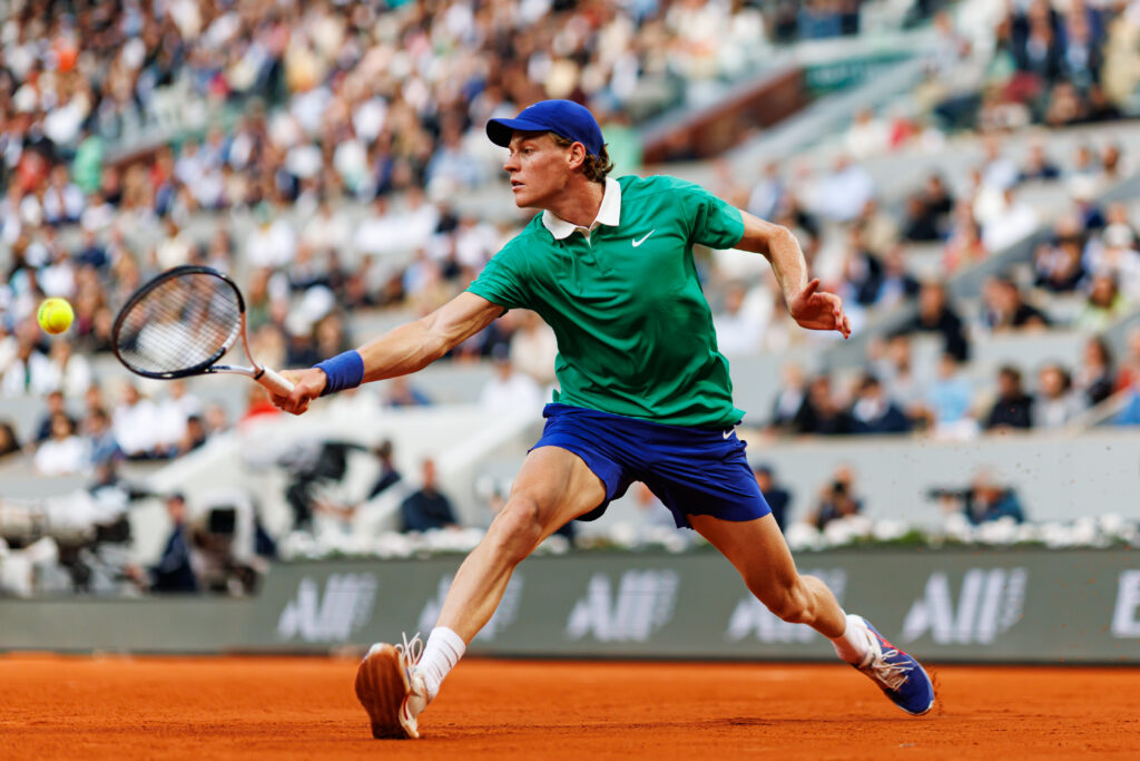 Jannik Sinner in action against Novak Djokovic in the semi-finals of the 2025 French Open