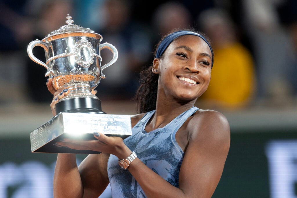 Coco Gauff lifts the title after winning the 2025 French Open