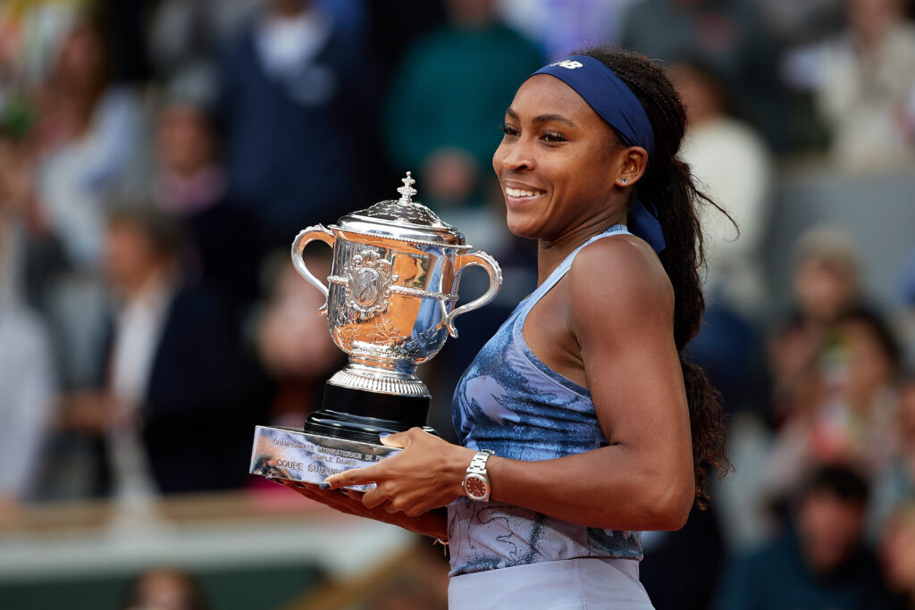 Coco Gauff poses with the trophy after beating Aryna Sabalenka in the 2025 French Open final
