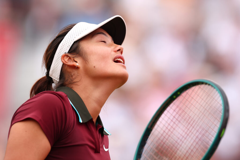 Emma Raducanu reacts during her defeat to Qinwen Zheng at Queen's in 2025