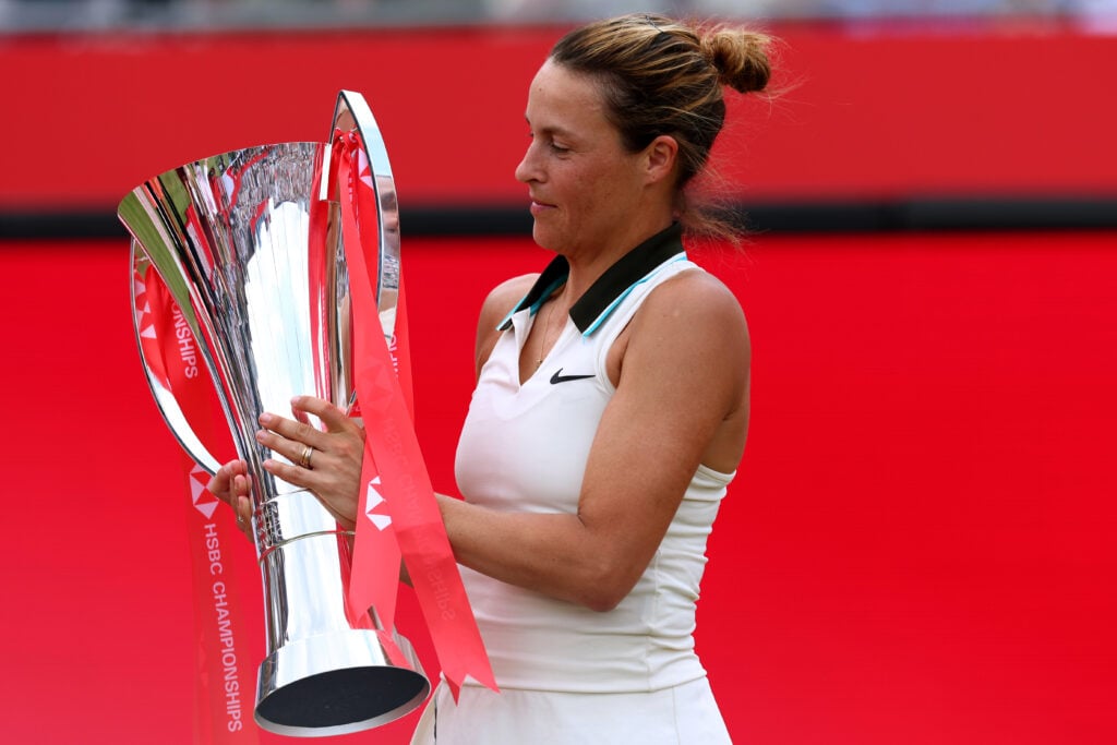 Tatjana Maria holds the women's singles trophy at The Queen's Club.