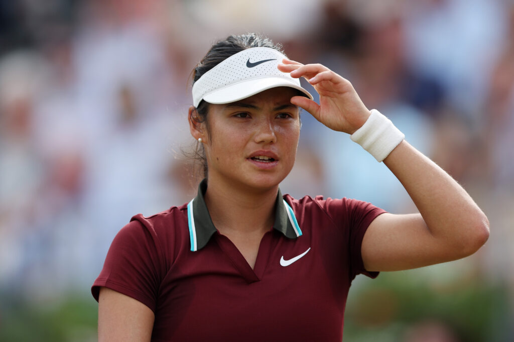 Emma Raducanu of Great Britain looks on against Zheng Qinwen of People's Republic of China during the Women's Singles Quarter Final match on Day Five of the 2025 HSBC Championships at The Queen's Club.