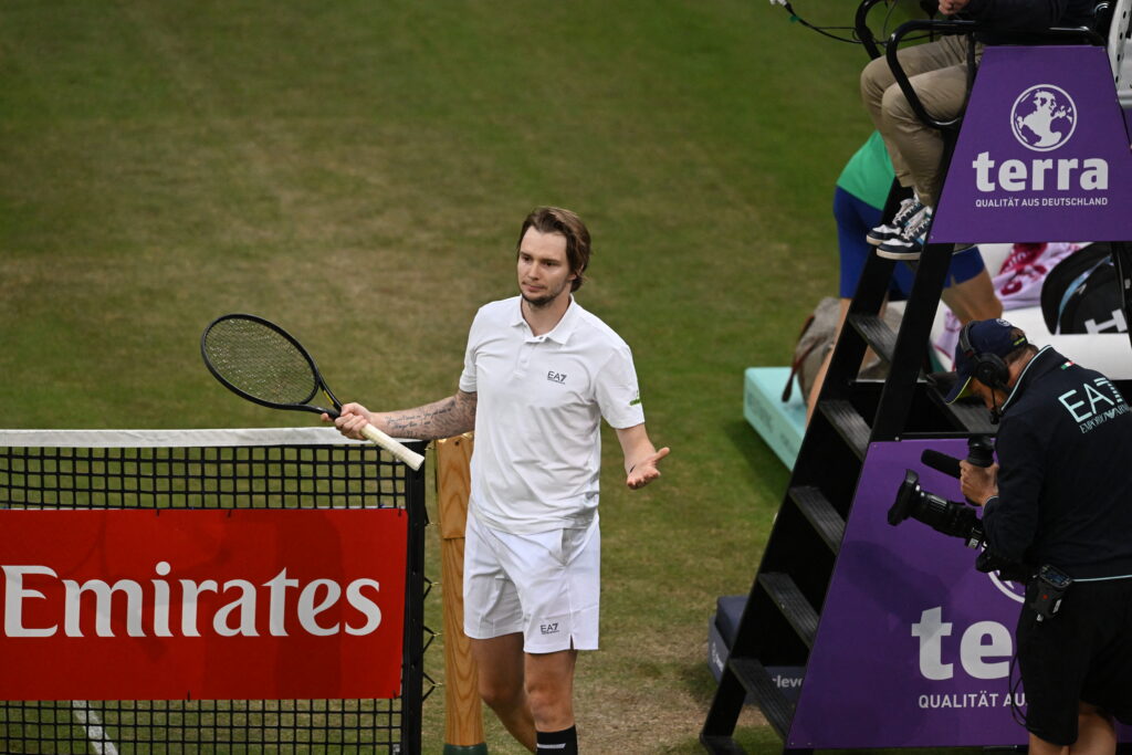 Alexander Bublik reacts after defeating Jannik Sinner at the Halle Open.