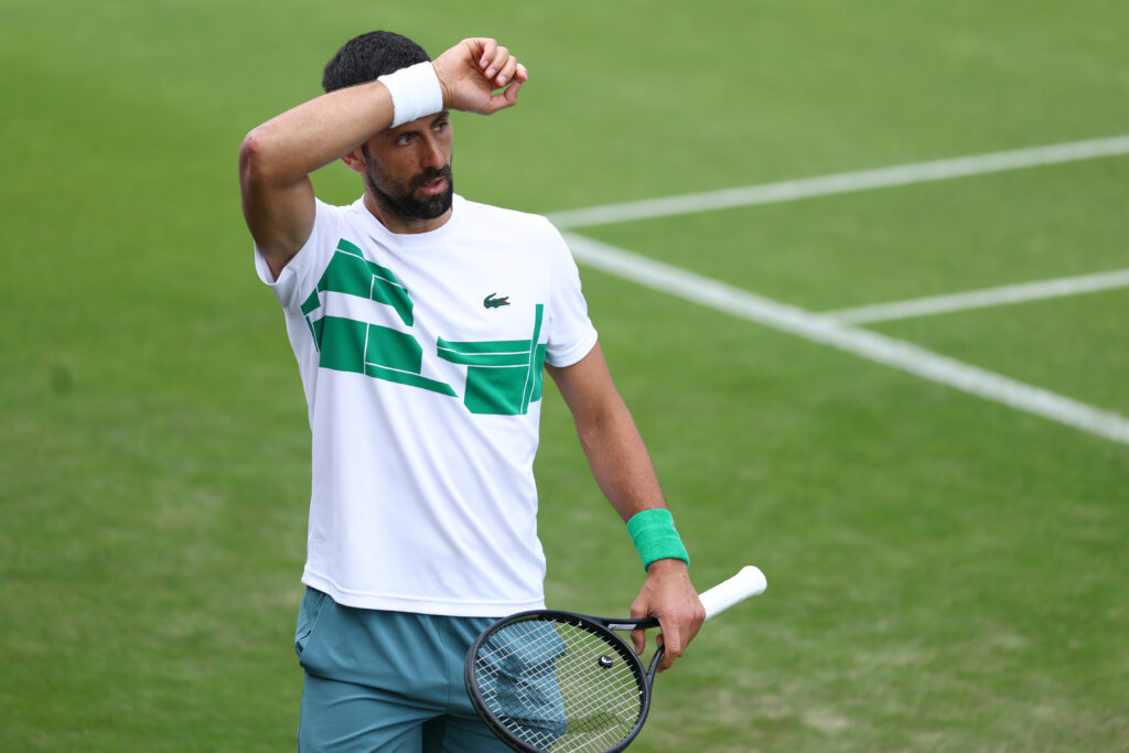 Novak Djokovic reacts during a practice session at Wimbledon in 2025