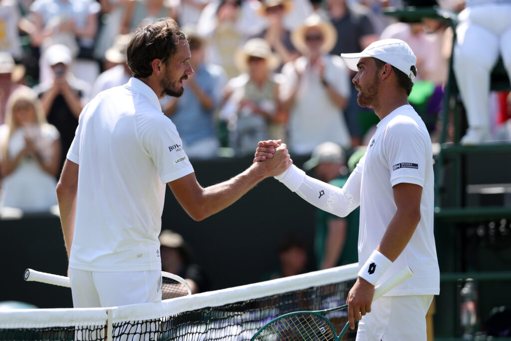 Daniil Medvedev and Benjamin Bonzi at the net following their match at Wimbledon.