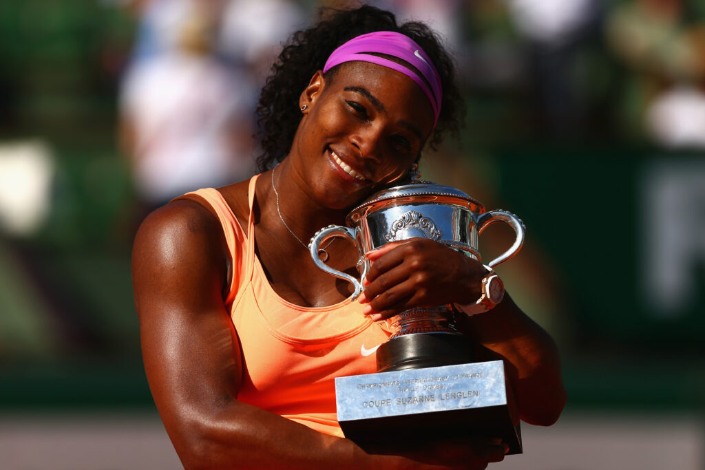 Serena Williams poses with the French Open title after winning in 2015
