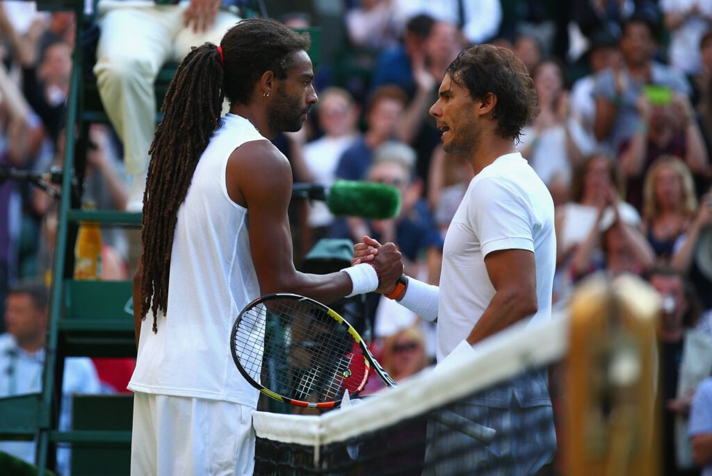Dustin Brown and Rafael Nadal shake hands at the net at Wimbledon in 2015.